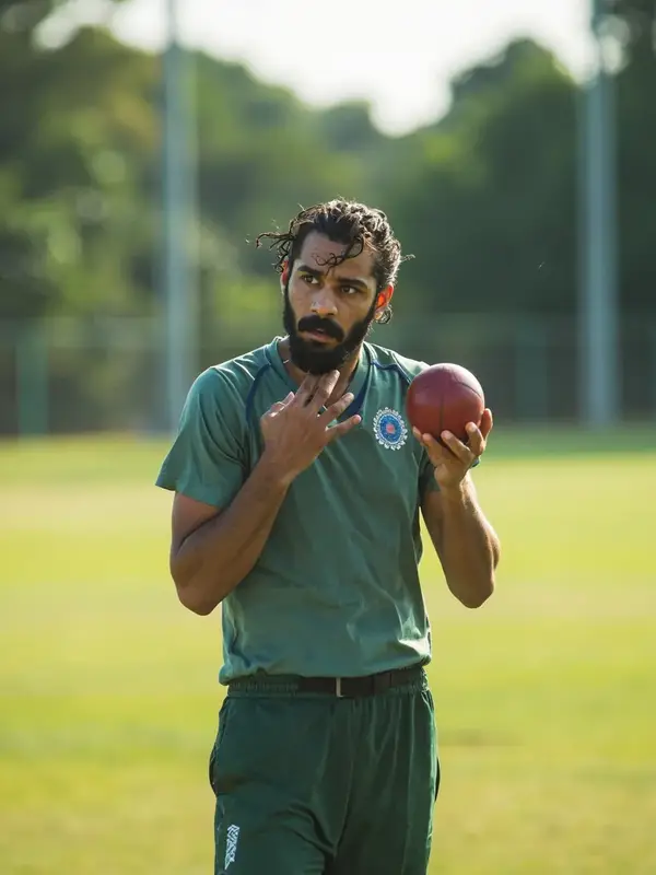 Indian fast bowler portrait in training whites under afternoon sun